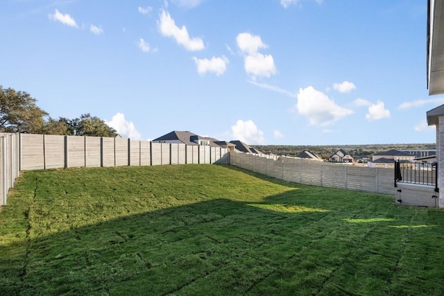 view of yard with a fenced backyard