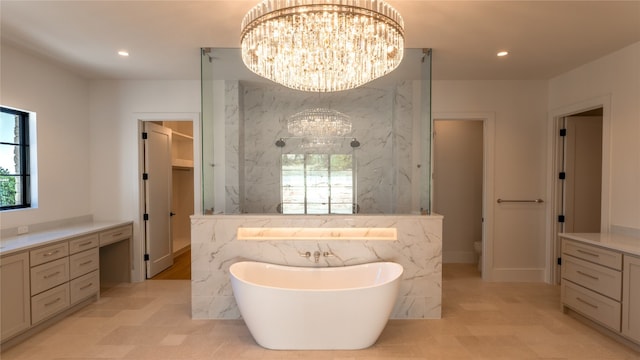 bathroom featuring a chandelier, toilet, and a bathing tub