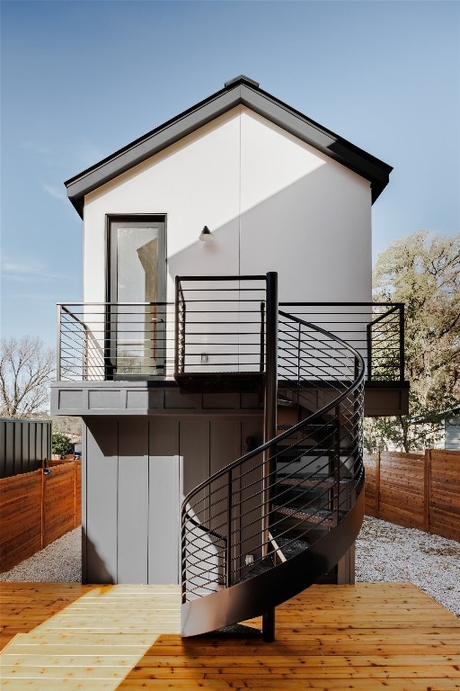 rear view of house with a balcony