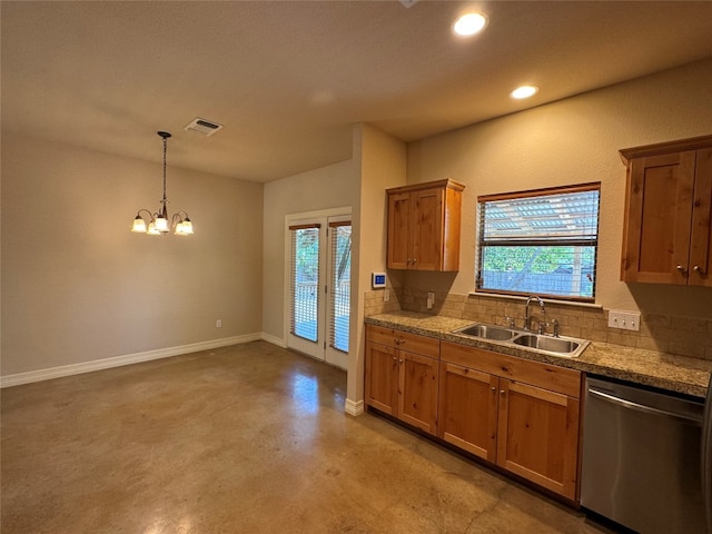 kitchen featuring decorative backsplash, sink, dishwasher, a chandelier, and hanging light fixtures