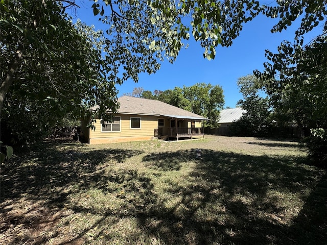 view of yard featuring a wooden deck