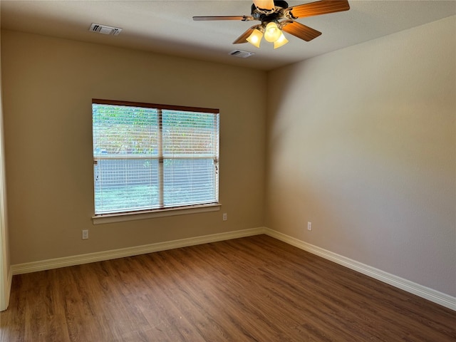 spare room with wood-type flooring and ceiling fan