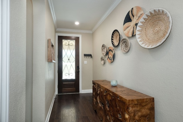 foyer entrance with dark wood-type flooring and ornamental molding