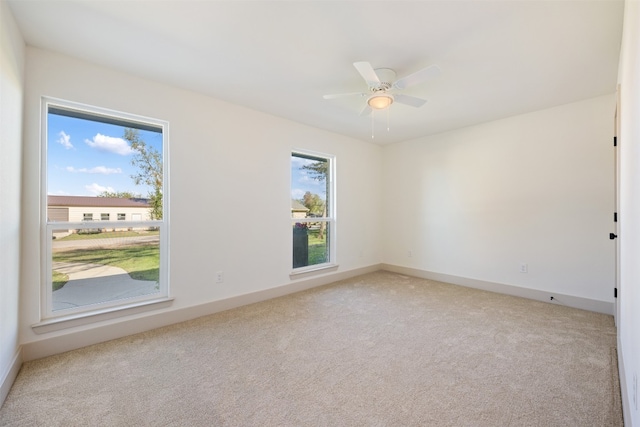 carpeted empty room with ceiling fan