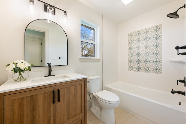 full bathroom with vanity, toilet, and tiled shower / bath