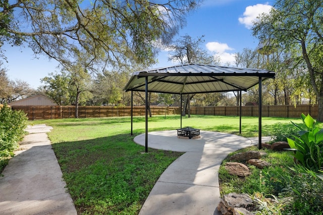 view of yard featuring a gazebo and a fire pit