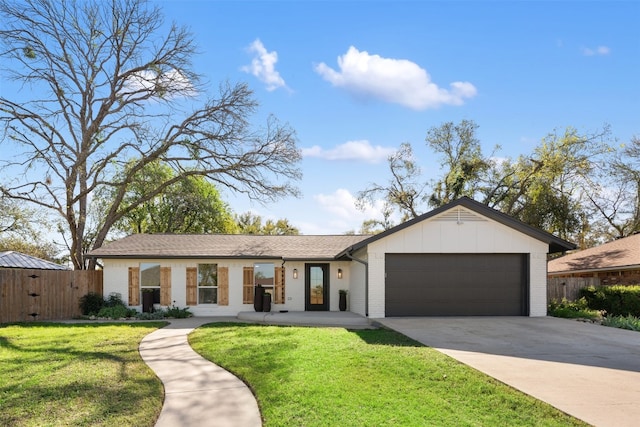 view of front of home featuring a garage and a front yard