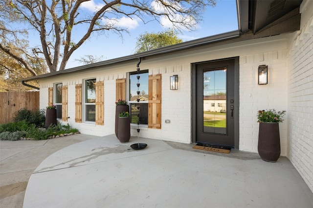 doorway to property with a patio