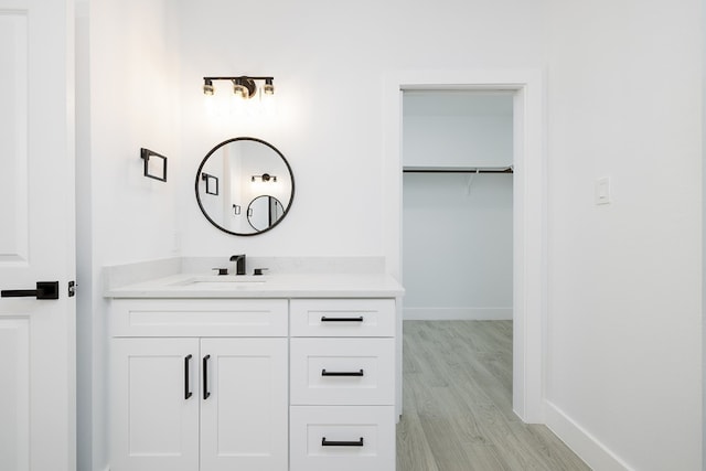 bathroom featuring vanity and wood-type flooring