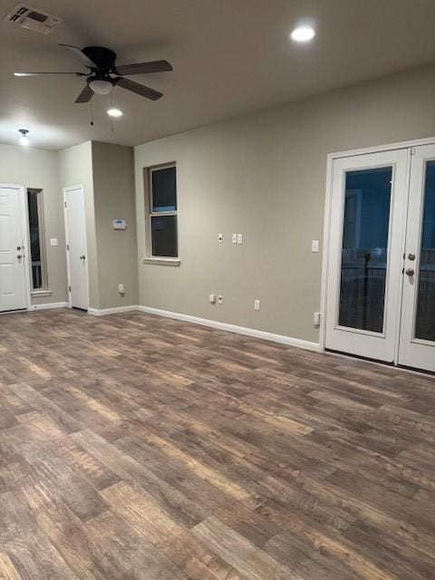 interior space with french doors, ceiling fan, and dark wood-type flooring