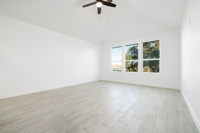 spare room featuring ceiling fan, light wood-type flooring, and high vaulted ceiling