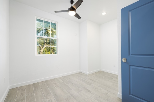 spare room with light hardwood / wood-style floors and ceiling fan