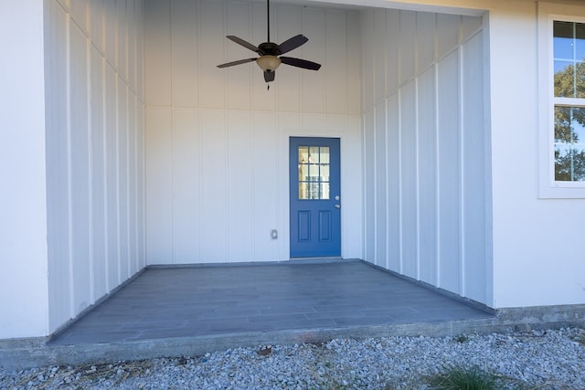 view of exterior entry with ceiling fan