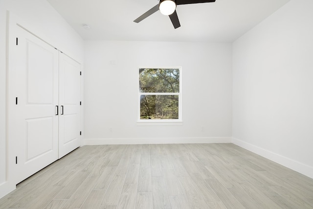 unfurnished bedroom featuring a closet, ceiling fan, and light hardwood / wood-style flooring