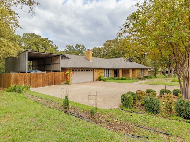 ranch-style home with a carport, a garage, and a front lawn