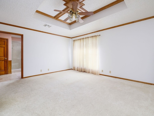 spare room featuring a textured ceiling, light colored carpet, ceiling fan, and ornamental molding