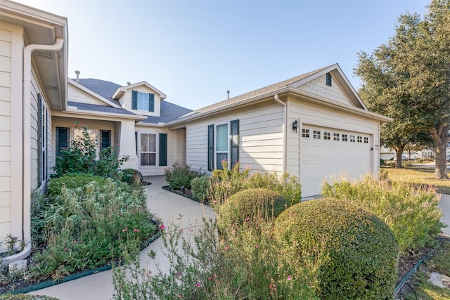 ranch-style home featuring a garage