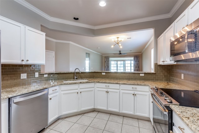 kitchen featuring stainless steel appliances, white cabinetry, crown molding, and sink