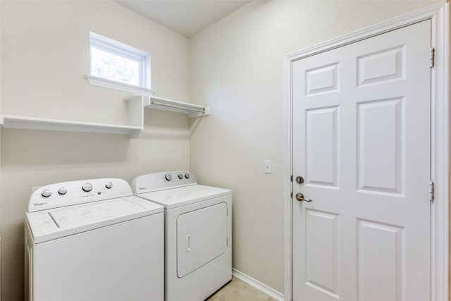 washroom featuring washing machine and clothes dryer