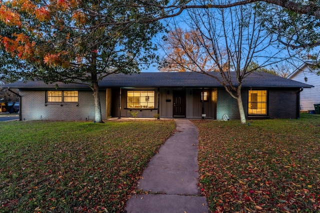 single story home with a front yard