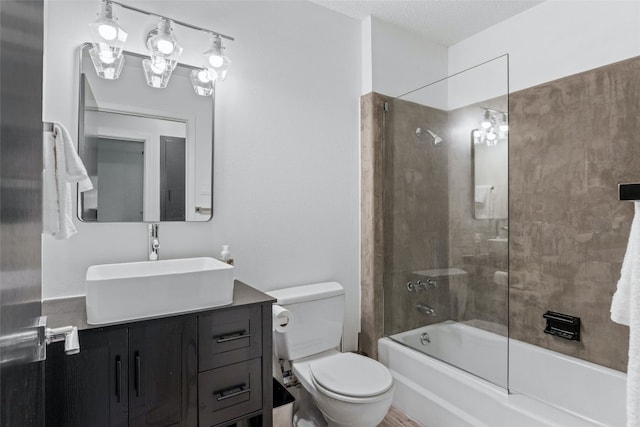 full bathroom featuring vanity, a textured ceiling, toilet, and enclosed tub / shower combo