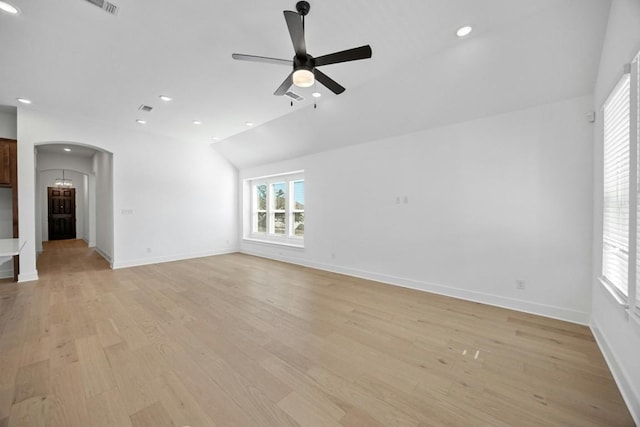 unfurnished living room featuring vaulted ceiling, ceiling fan, and light hardwood / wood-style floors