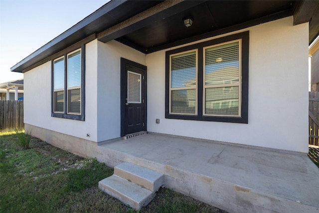 property entrance with covered porch