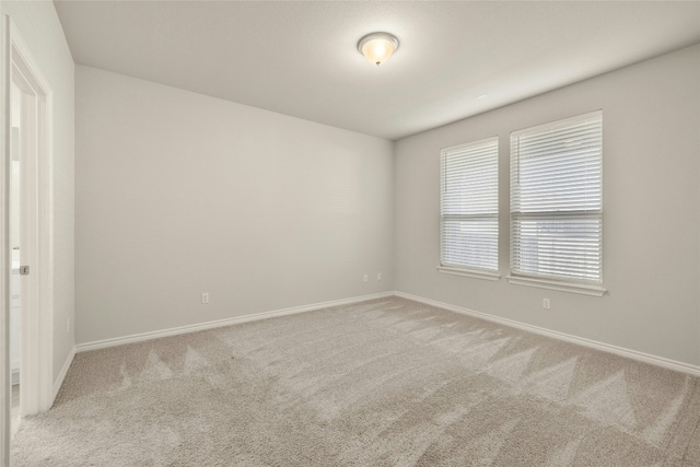 empty room featuring light colored carpet