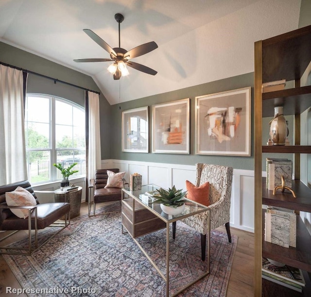 sitting room featuring ceiling fan, dark hardwood / wood-style floors, and lofted ceiling