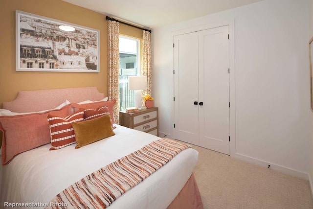 carpeted bedroom with multiple windows and a closet