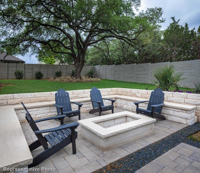 view of patio / terrace with a fire pit