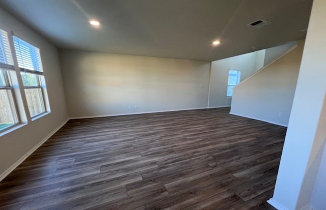 unfurnished room featuring dark hardwood / wood-style floors