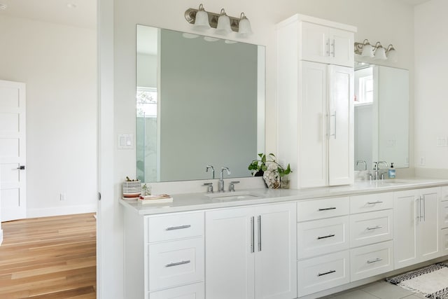 bathroom featuring vanity and hardwood / wood-style flooring