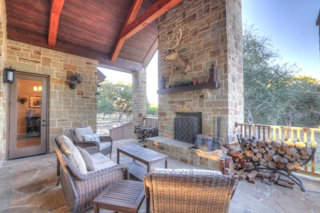 view of patio / terrace with an outdoor stone fireplace