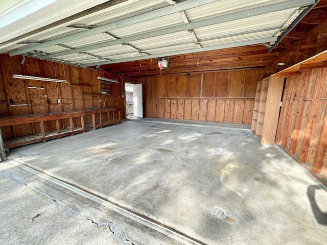 garage featuring wood walls