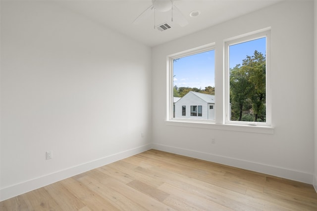 spare room featuring ceiling fan and light hardwood / wood-style floors