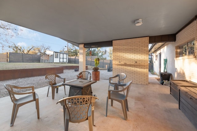 view of patio with a shed