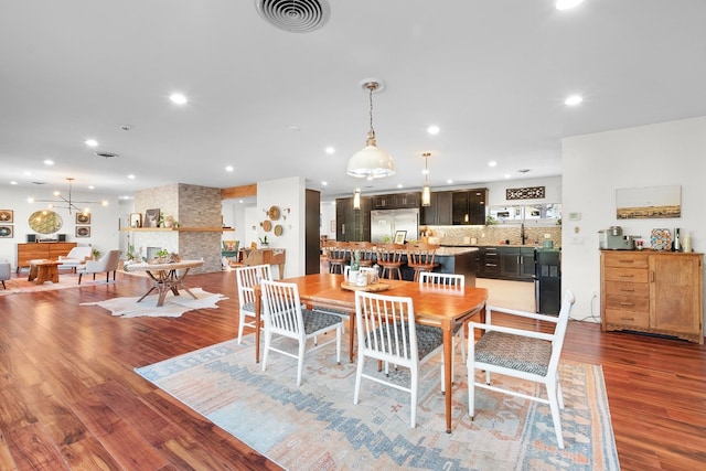 dining space with dark hardwood / wood-style floors