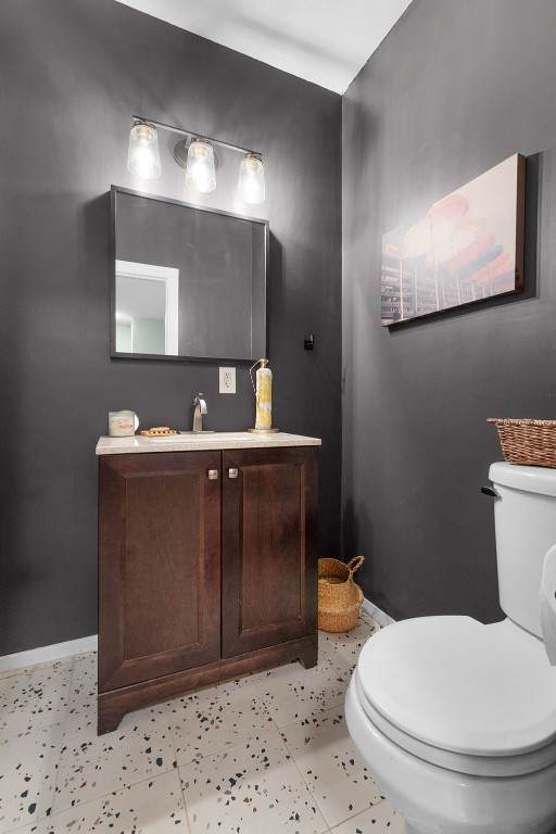 bathroom featuring vanity and toilet