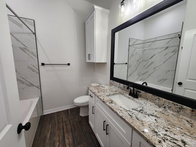 full bathroom featuring vanity, toilet, and tiled shower / bath combo