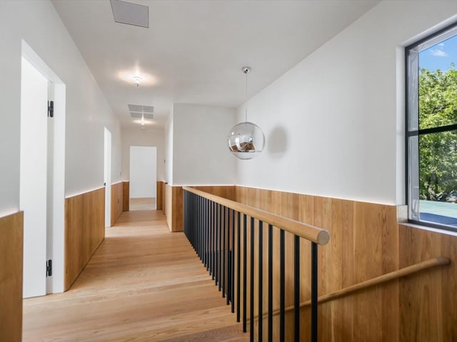 corridor featuring light hardwood / wood-style floors