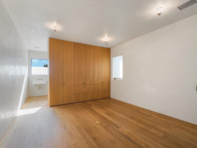 unfurnished bedroom featuring light hardwood / wood-style floors