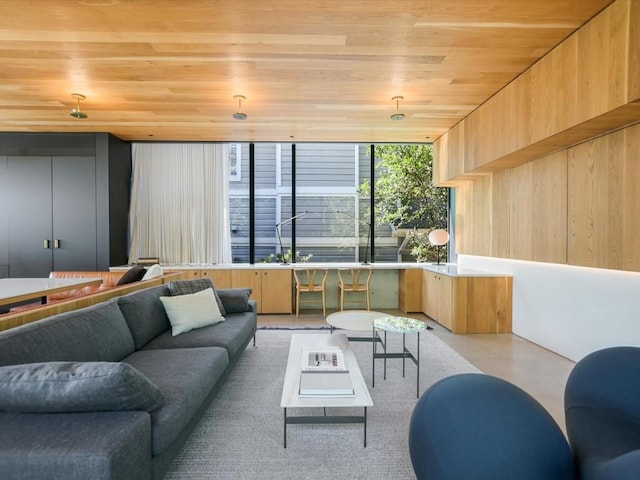 living room with wooden ceiling and wood walls