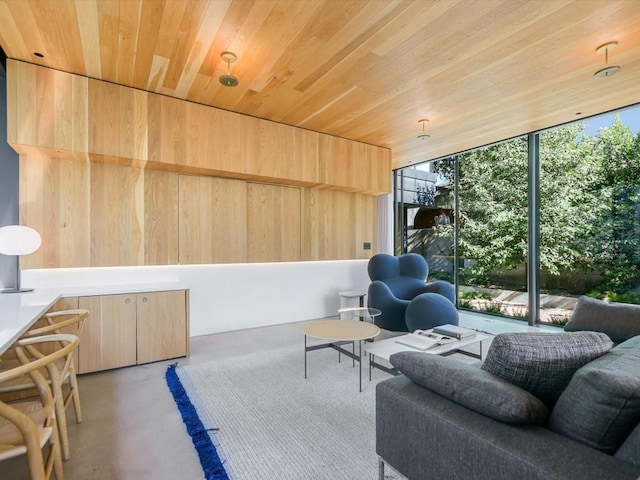 interior space featuring wood walls and wooden ceiling