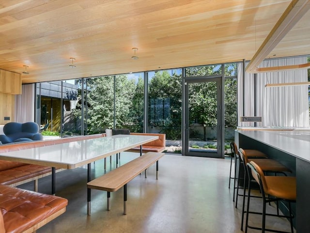 sunroom featuring wood ceiling