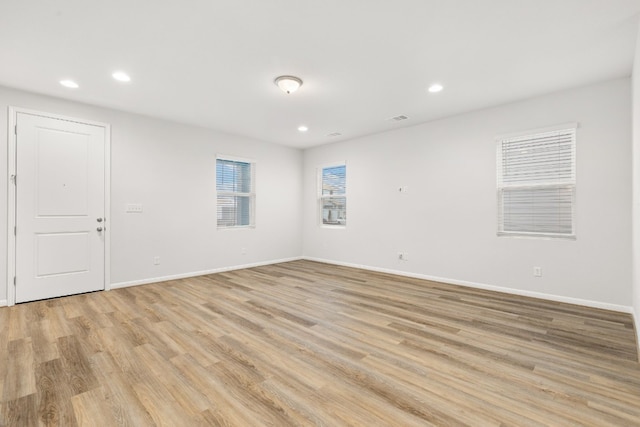 spare room with light wood-type flooring