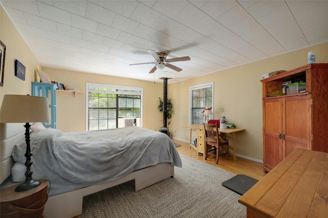 bedroom featuring light wood-type flooring and ceiling fan