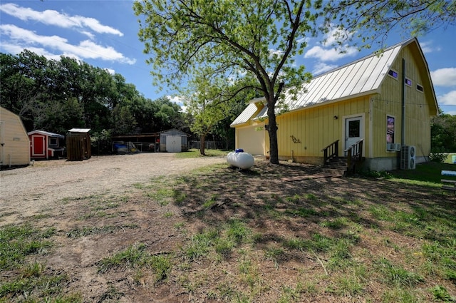 1137 Loop 163 Loop, Blanco, TX 78606 - view of yard featuring entry steps, dirt driveway, and ac unit