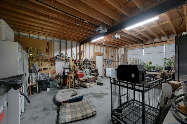 garage featuring a workshop area and a garage door opener