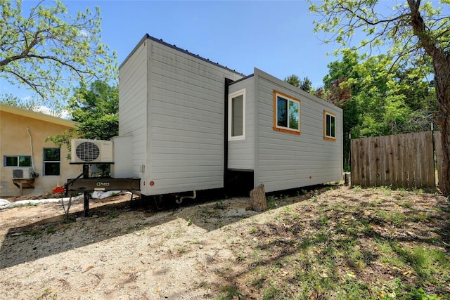 view of side of home featuring cooling unit